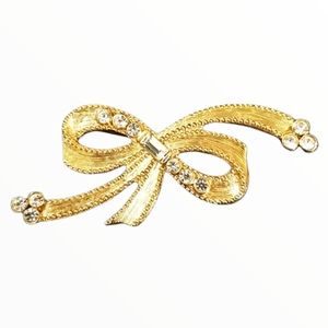 1928 BOW PIN WITH CLEAR CRYSTALS